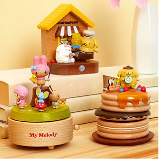 Wooden Pompompurin Music Boxes and Trinket Box on a nightstand next to a lamp