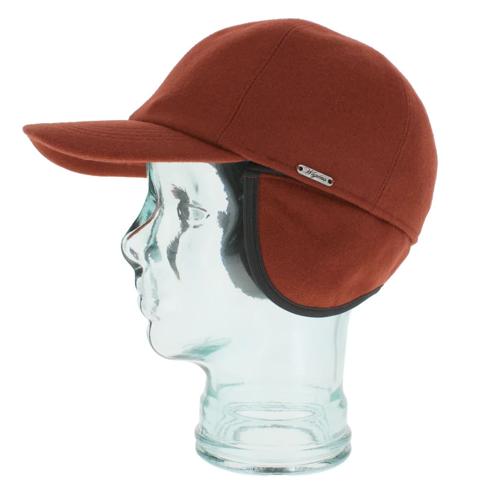 Rust colored cap on a glass mannequin head